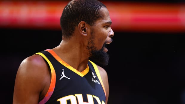 Phoenix Suns forward Kevin Durant reacts against the Denver Nuggets in the second half at Footprint Center.